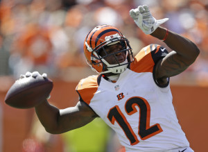 Cincinnati Bengals wide receiver Mohamed Sanu throws a 50-yard pass in the first half of an NFL football game against the Atlanta Falcons, Sunday, Sept. 14, 2014, in Cincinnati. (AP Photo/Michael Conroy)