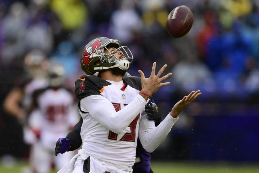 Dec 16, 2018; Baltimore, MD, USA; Tampa Bay Buccaneers wide receiver Mike Evans (13) catches a pass in front Baltimore Ravens cornerback Jimmy Smith (22) during the second quarter at M&T Bank Stadium. Mandatory Credit: Tommy Gilligan-USA TODAY Sports