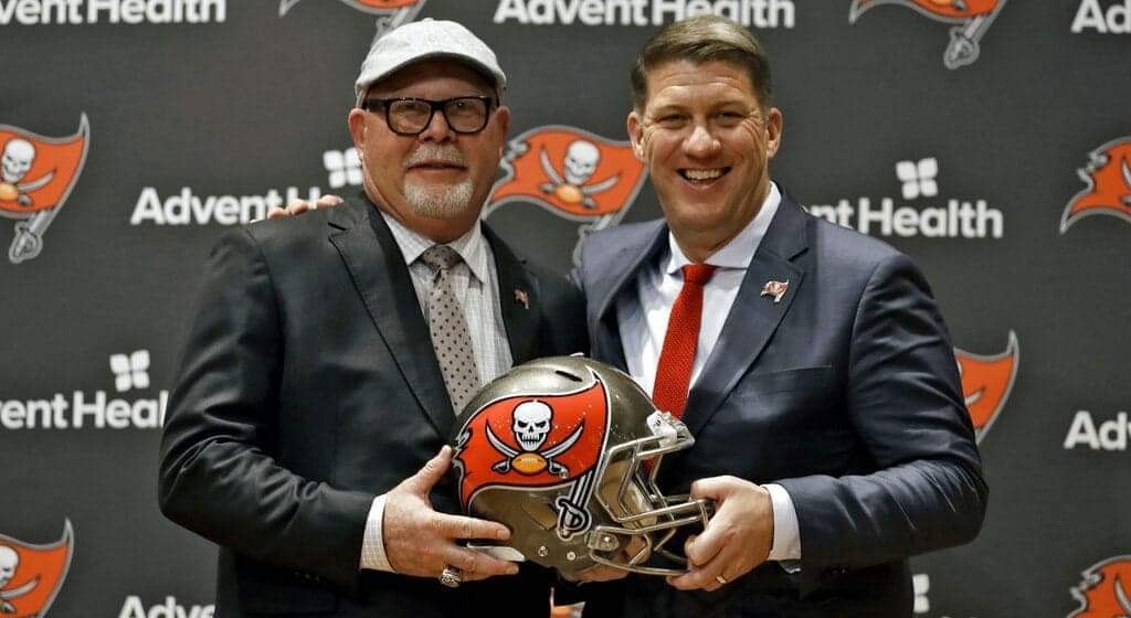 Tampa Bay Buccaneers head coach Bruce Arians, left, smiles as he stands with general manager Jason Licht after Arians was introduced during a news conference Thursday, Jan. 10, 2019, in Tampa, Fla. (AP Photo/Chris O'Meara)
