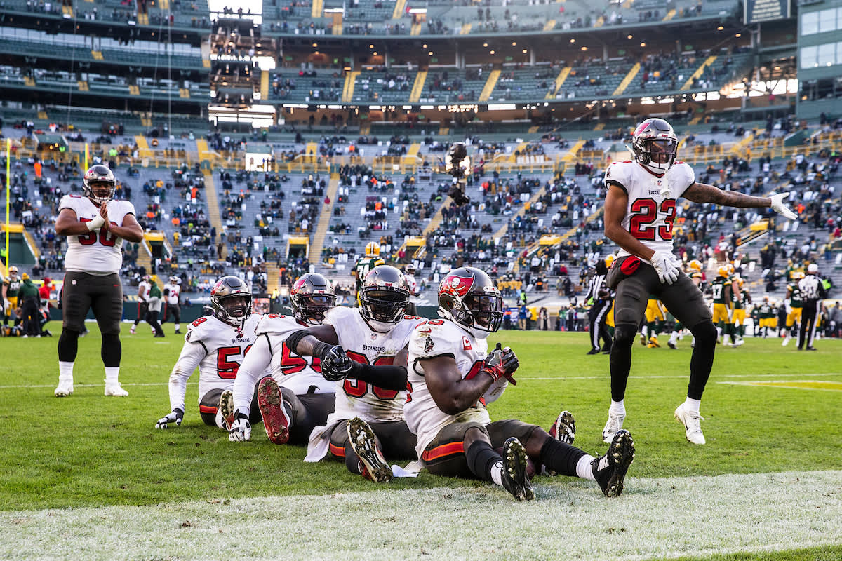 GREEN BAY, WI - JANUARY 24, 2021 - Inside Linebacker Devin White #45, Outside Linebacker Jason Pierre-Paul #90, Defensive Tackle Rakeem Nunez-Roches #56, Outside Linebacker Shaquil Barrett #58, and Cornerback Sean Murphy-Bunting #23 of the Tampa Bay Buccaneers celebrate a turnover during the NFC Championship game between the Tampa Bay Buccaneers and Green Bay Packers at Lambeau Field. The Buccaneers won the game 31-26. Photo By Kyle Zedaker/Tampa Bay Buccaneers