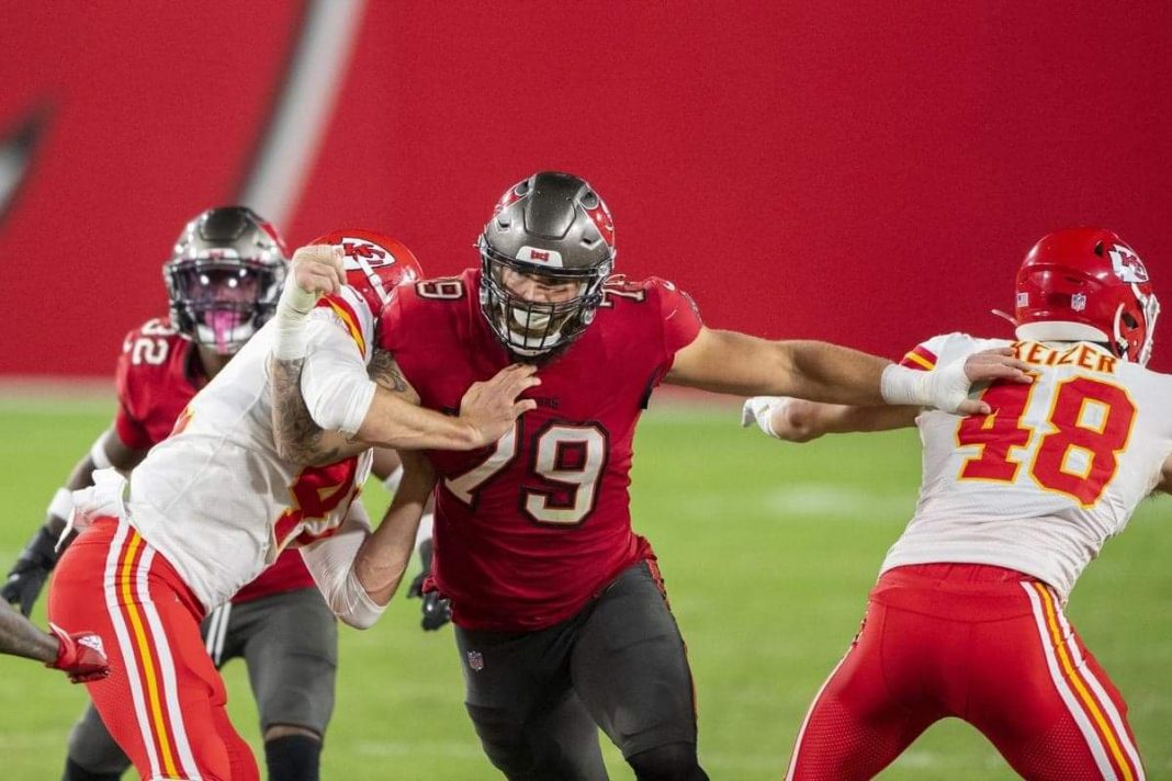 Tampa Bay Buccaneers defensive lineman Patrick O'Connor (79), a St. Rita graduate, works through the blocks of long snapper James Winchester (41) and tight end Nick Keizer (48) during a game against the Kansas City Chiefs on Sunday, Nov. 29, 2020. (Doug Murray / AP)