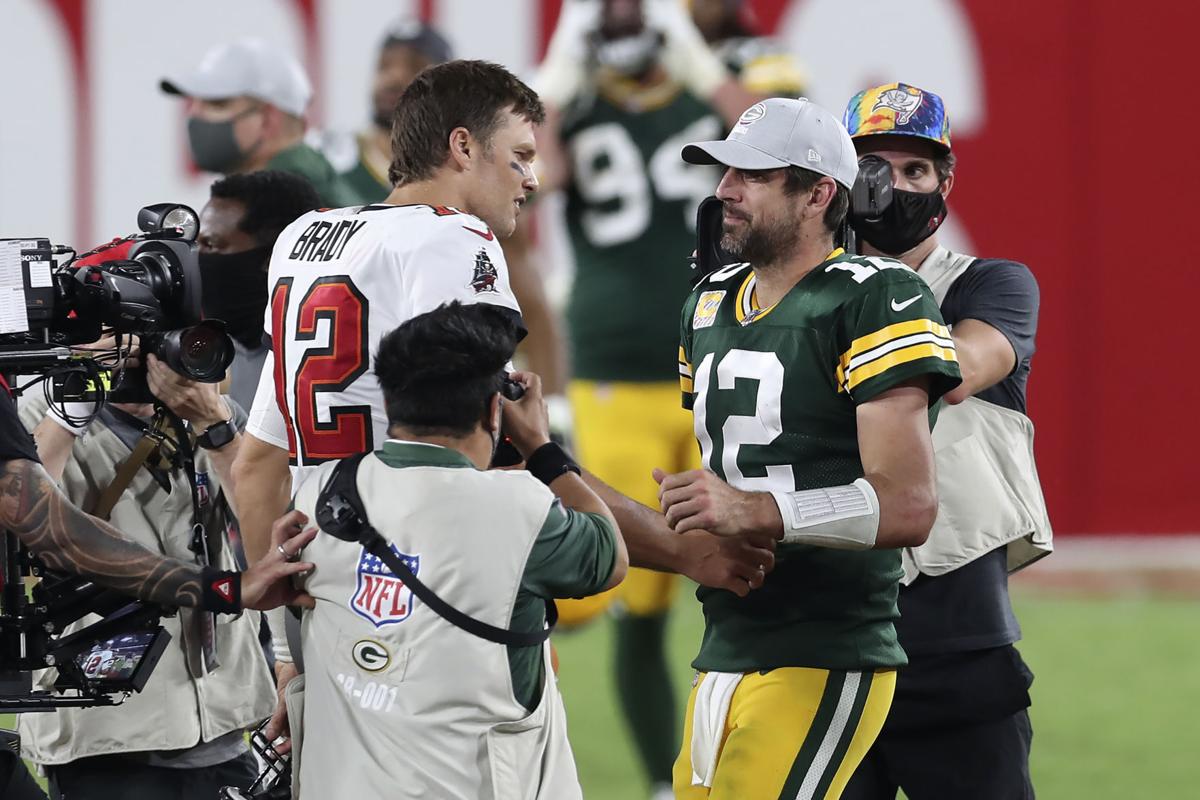 Buccaneers quarterback Tom Brady shakes hands with Packers quarterback Aaron Rodgers after the Bucs' victory on Oct. 18 in Tampa, Fla. MARK LOMOGLIO, ASSOCIATED PRESS