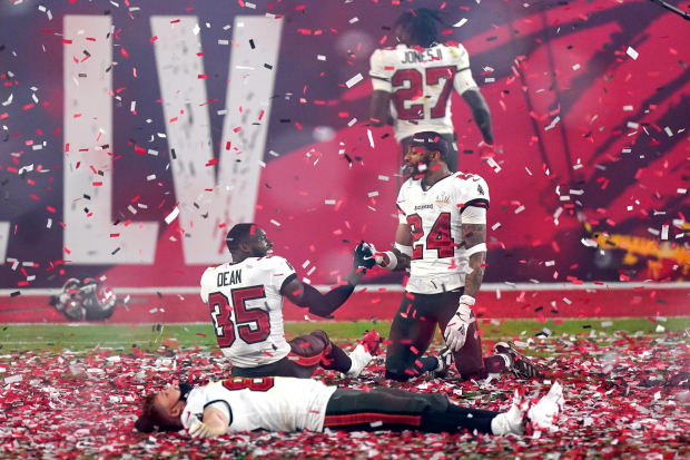 Tampa Bay Buccaneers players celebrate after the NFL Super Bowl 55 football game against the Kansas City Chiefs, Sunday, Feb. 7, 2021, in Tampa, Fla. The Buccaneers defeated the Chiefs 31-9 to win the Super Bowl. (AP Photo/Mark Humphrey)