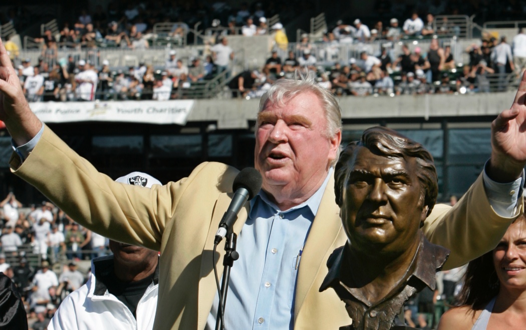 Former Oakland Raiders head coach John Madden gestures during a ceremony where he was presented his Hall of Fame ring before the Oakland Raiders and Arizona Cardinals NFL football game, Sunday, Oct. 22, 2006 in Oakland, Calif. The Raiders defeated the Cardinals 22-9. (AP Photo/Paul Sakuma)