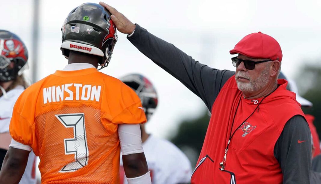 Tampa Bay Buccaneers head coach Bruce Arians pats quarterback Jameis Winston (3) on the helmet during an NFL football training camp practice Saturday, July 27, 2019, in Tampa, Fla. (AP Photo/Chris O'Meara)