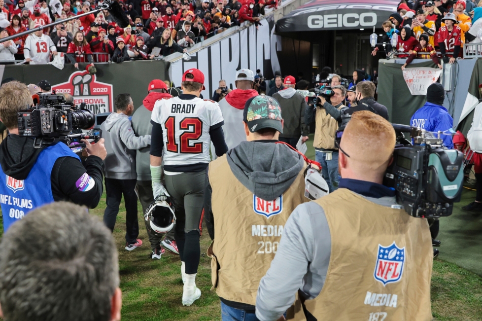 Tampa Bay Buccaneers quarterback Tom Brady walks off the field – likely for the last time – following a loss to the Los Angeles Rams in a divisional-round playoff game last Sunday in Tampa/ via Alex Menendez/The Associated Press