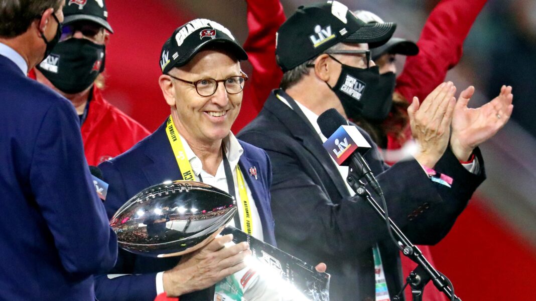Tampa Bay Buccaneers owner Joel Glazer celebrates with the Vince Lombardi Trophy after the Tampa Bay Buccaneers beat the Kansas City Chiefs in Super Bowl LV at Raymond James Stadium/ via USA Today