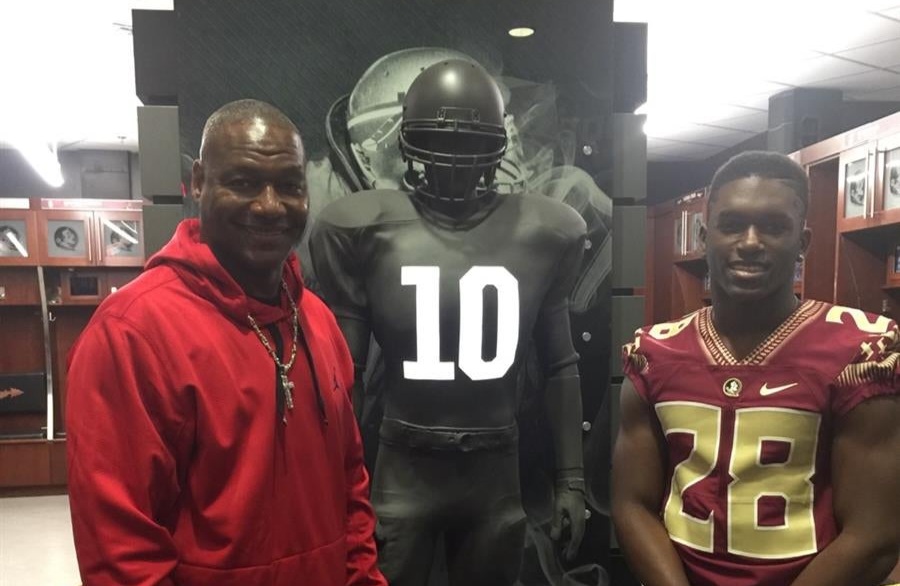 Former Buccaneers great Derrick Brooks and his son DeCalon/via 24/7 Sports