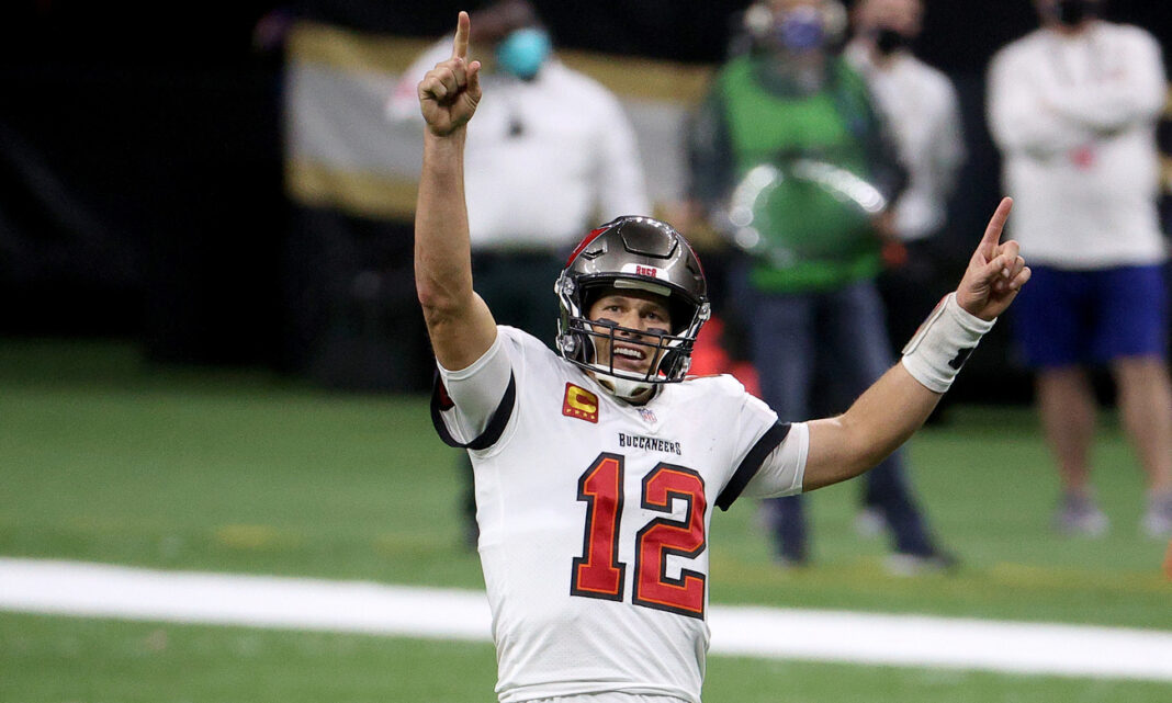 Tom Brady #12 of the Tampa Bay Buccaneers celebrates a first down against the New Orleans Saints late in the fourth quarter in the NFC Divisional Playoff game at Mercedes Benz Superdome on January 17, 2021 in New Orleans, Louisiana. (Photo by Chris Graythen/Getty Images)
