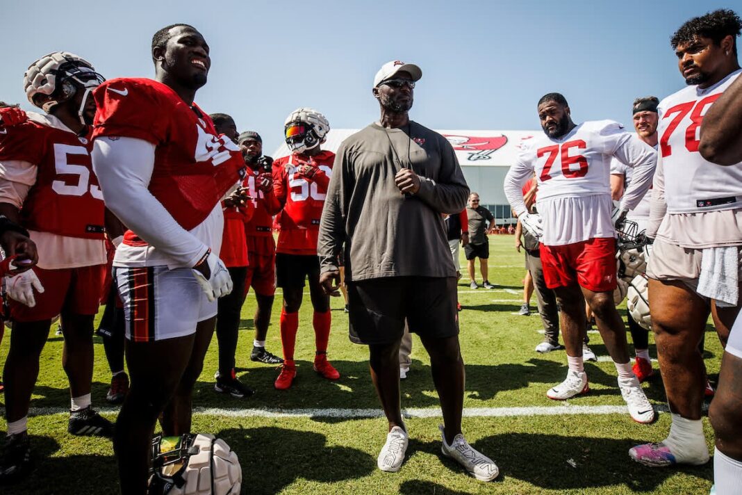 Buccaneers' head coach Todd Bowles talks with players at Bucs' training camp/via buccaneers.com