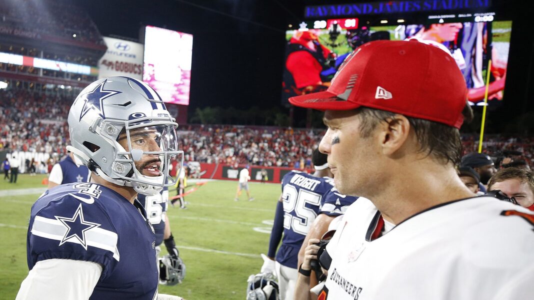 Dallas Cowboys quarterback Dak Prescot (left) and Tampa Bay Buccaneers quarterback Tom Brady (right) talk on the field after an NFL football game against the Tampa Bay Buccaneers, Thurs., Sept. 9, 2021, in Tampa, Fla. The Buccaneers defeated the Cowboys, 31-29.(James D. Smith / AP)