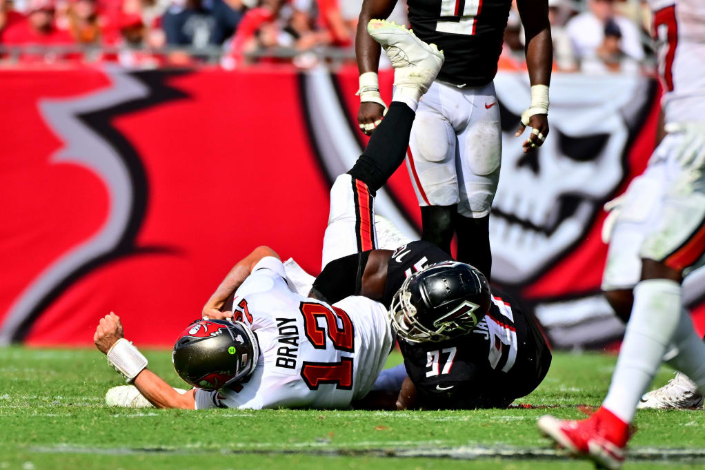 Grady Jarrett #97 of the Atlanta Falcons sacks Tom Brady #12 of the Tampa Bay Buccaneers during the fourth quarter of the game at Raymond James Stadium on October 09, 2022 in Tampa, Florida. (Photo by Julio Aguilar/Getty Images)