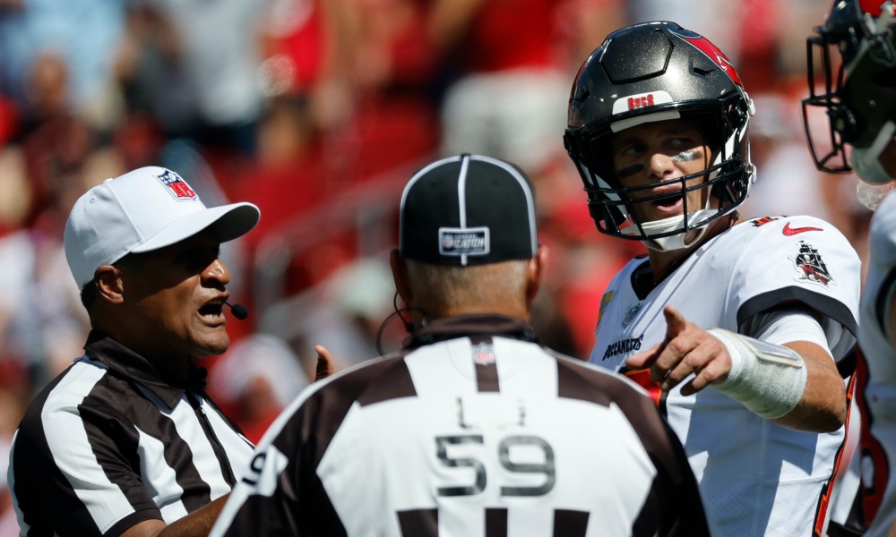 Buccaneers' quarterback Tom Brady talks with NFL Referee Jerome Boger / via USA Today