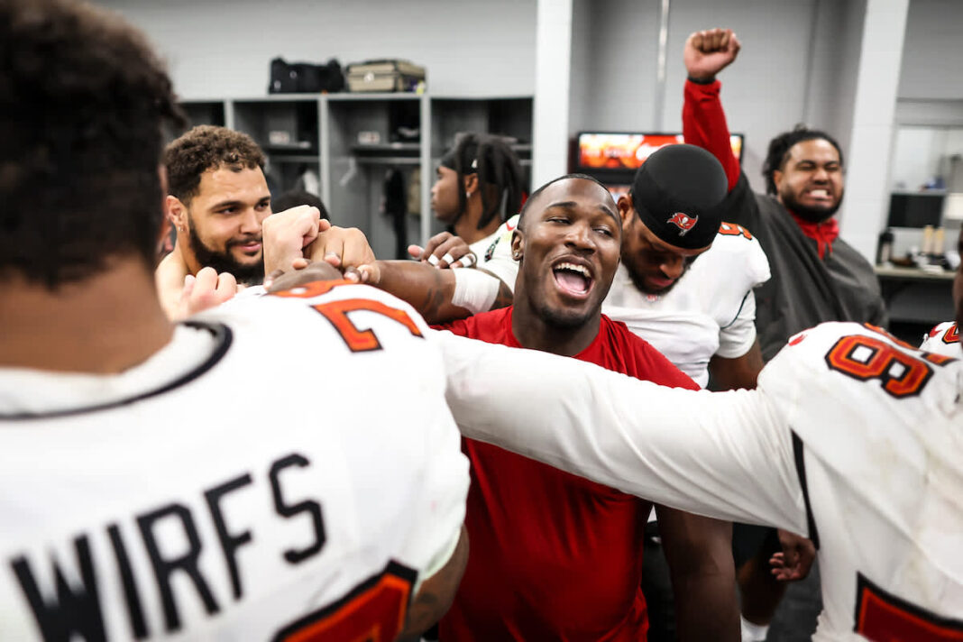 Buccaneers' players celebrate after a victory / via buccaneers.com