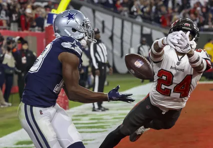 Buccaneers' cornerback Carlton Davis can’t pull the ball in as Cowboys wide receiver Michael Gallup scores a third-quarter touchdown Monday night. [ DOUGLAS R. CLIFFORD | Times ]