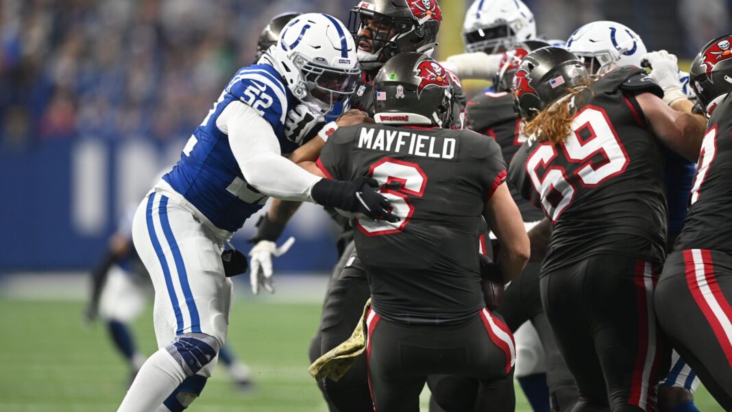 Buccaneers quarterback Baker Mayfield is pressured by the Indianapolis Colts defense / via colts.com
