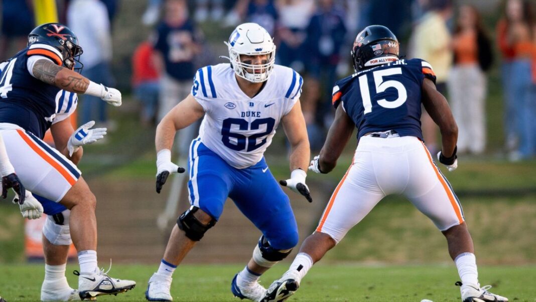 Should the Tampa Bay Buccaneers consider taking Duke offensive lineman Graham Barton in the NFL Draft? / Should the Tampa Bay Buccaneers consider drafting Duke offensive lineman Graham Barton? / via (AP Photo/Mike Caudill)